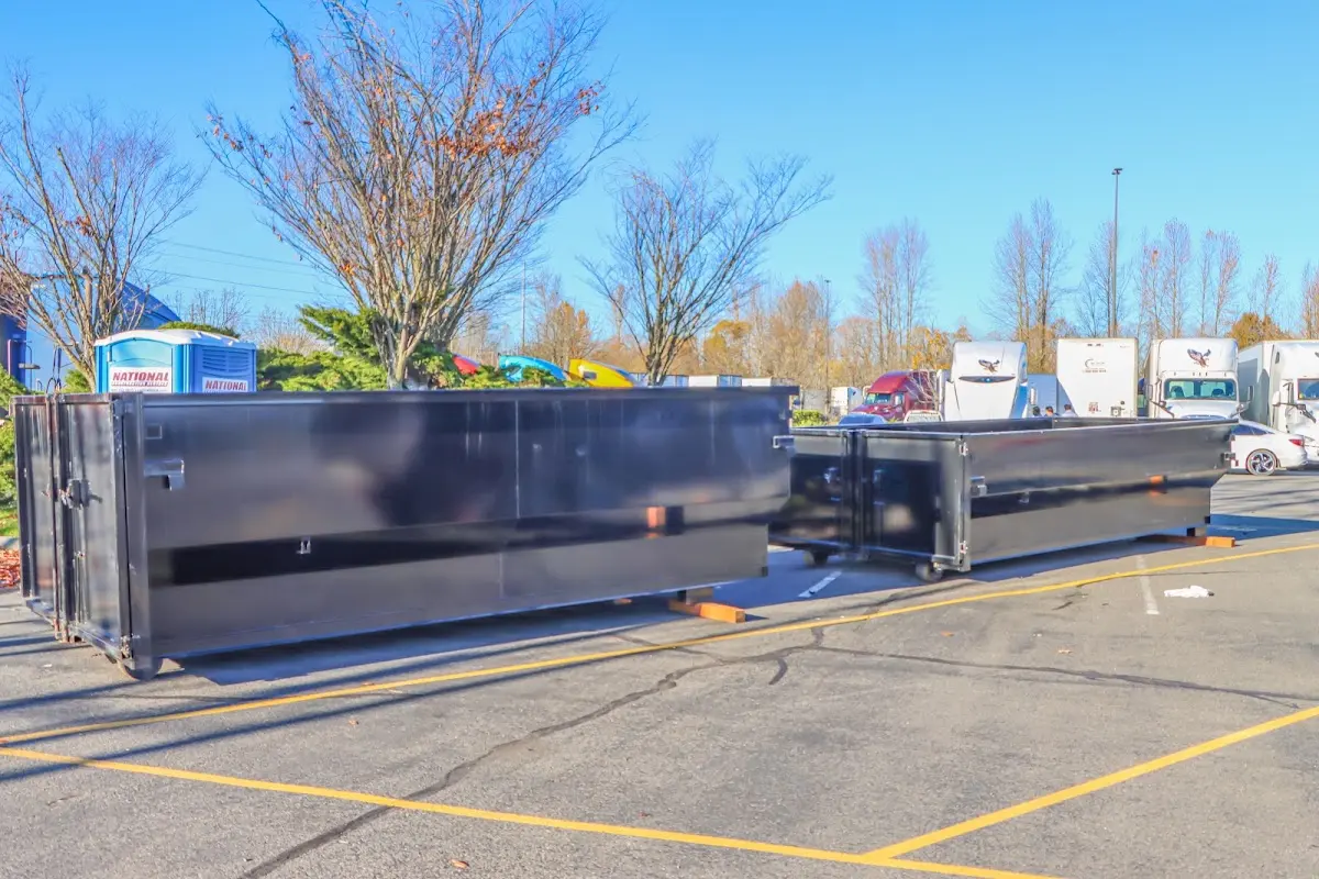 Professional dumpster rental service with roll-off container on residential driveway in Maltby